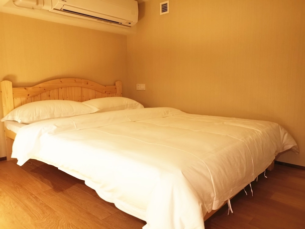 Imagen de la habitación del Hotel Efc Qingchengli Loft Apartment. Foto 13