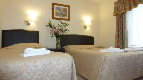 Imagen de la habitación del Hotel Egans Guest House. Foto 11