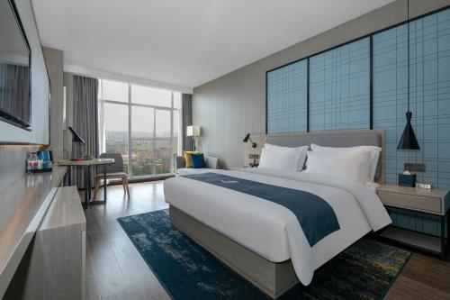 Imagen de la habitación del Hotel Eharm Jingzhou Olympic Sports Center. Foto 14