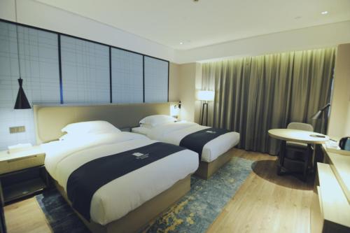 Imagen de la habitación del Hotel Eharm Nanning Chaoyang Plaza Riverview. Foto 15