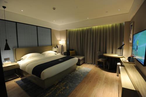 Imagen de la habitación del Hotel Eharm Nanning Chaoyang Plaza Riverview. Foto 16