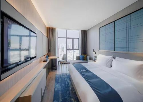 Imagen de la habitación del Hotel Eharm Nanning Donggemacun Metro Station. Foto 11