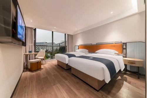 Imagen general del Hotel Eharm Wuhan Optics Valley University Park Road. Foto 4