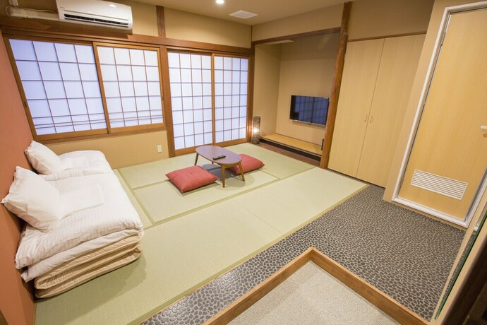 Imagen de la habitación del Hotel E-hostel Shinsaibashi. Foto 4