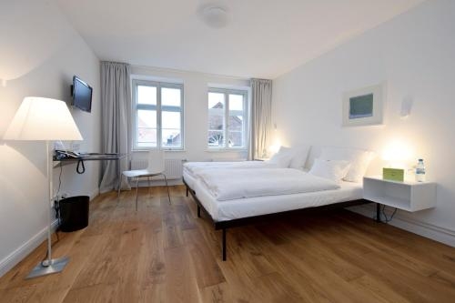 Imagen de la habitación del Hotel Einzigartig - Das Kleine Im Wasserviertel. Foto 7
