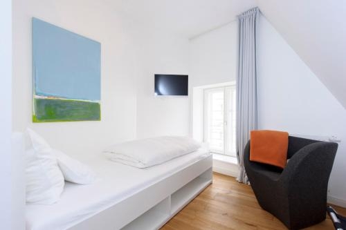Imagen de la habitación del Hotel Einzigartig - Das Kleine Im Wasserviertel. Foto 9