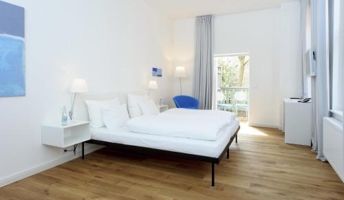 Imagen de la habitación del Hotel Einzigartig - Das Kleine Im Wasserviertel. Foto 10