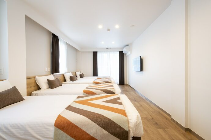 Imagen de la habitación del Hotel Eisei Stay. Foto 11