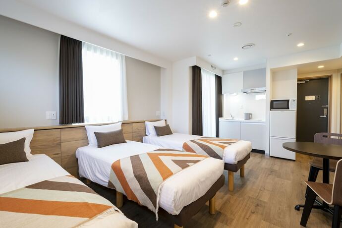 Imagen de la habitación del Hotel Eisei Stay. Foto 16