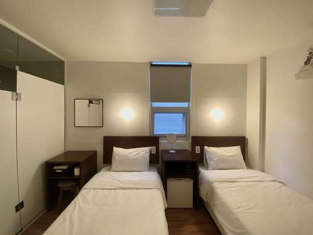 Imagen de la habitación del Hotel Ekonomy Haeundae Guesthouse. Foto 13
