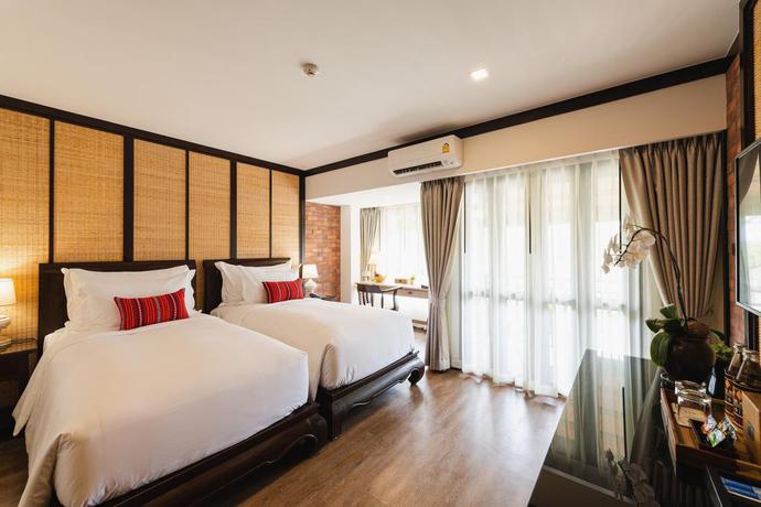 Imagen de la habitación del Hotel El Barrio Lanna. Foto 11