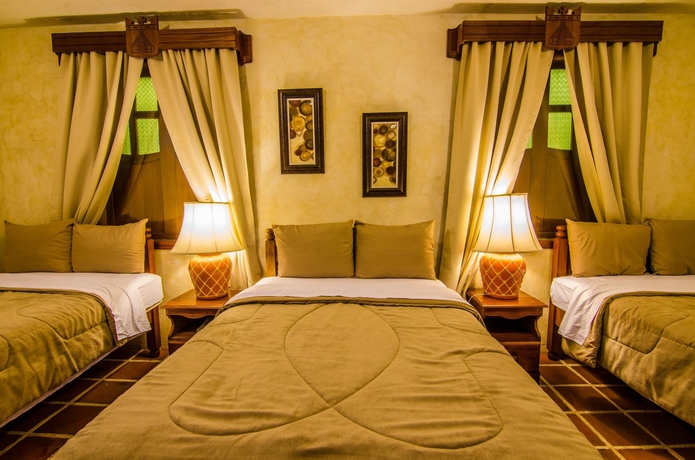 Imagen de la habitación del Hotel El Carmen Suites. Foto 5