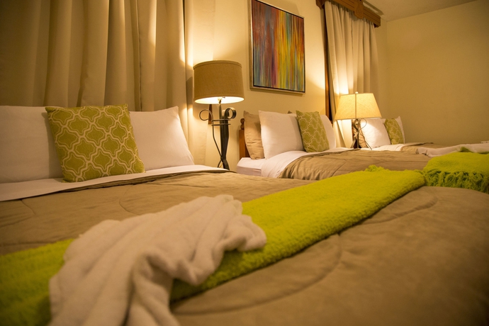 Imagen de la habitación del Hotel El Carmen Suites. Foto 11