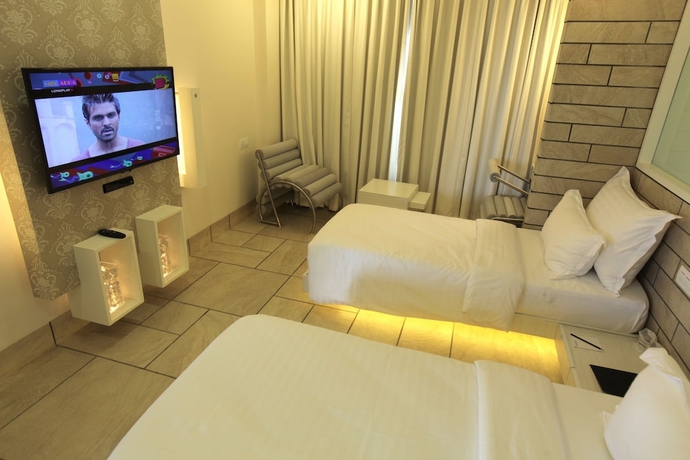 Imagen de la habitación del Hotel El Dorado, Ahmedabad. Foto 9