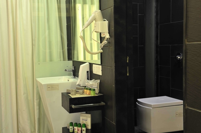 Imagen de la habitación del Hotel El Dorado, Ahmedabad. Foto 11