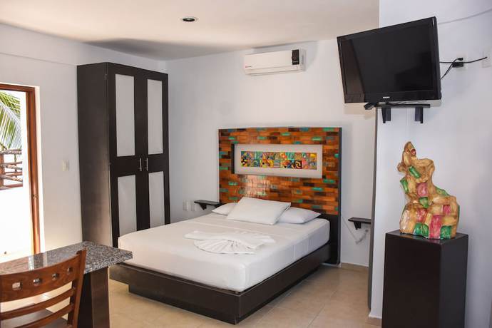 Imagen de la habitación del Hotel El Fuerte Beach Resort. Foto 11