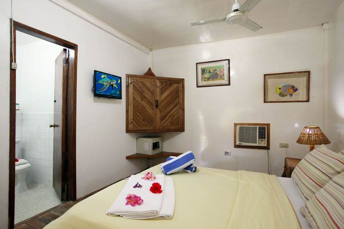 Imagen de la habitación del Hotel El Galleon Beach Resort Asia Divers. Foto 13