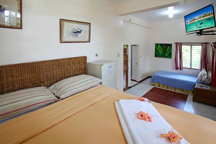 Imagen de la habitación del Hotel El Galleon Beach Resort Asia Divers. Foto 17