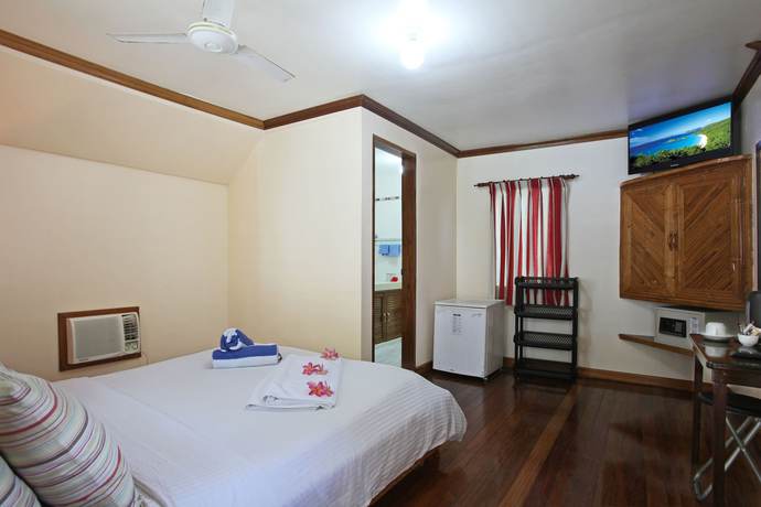 Imagen de la habitación del Hotel El Galleon Beach Resort Asia Divers. Foto 19
