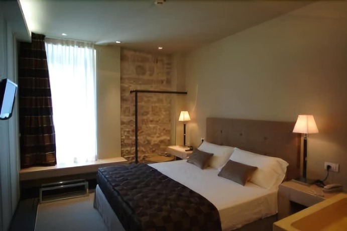 Imagen de la habitación del Hotel El Homs Palace. Foto 12