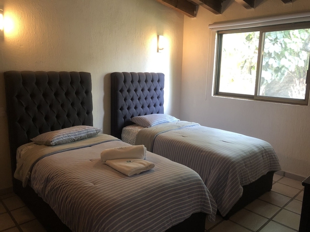 Imagen de la habitación del Hotel El Jard&iacute;n De En Medio. Foto 5