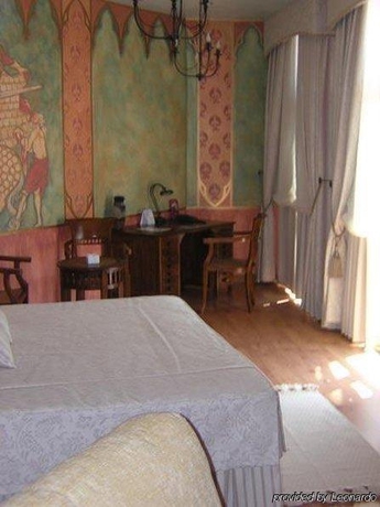 Imagen de la habitación del Hotel El Jardín De La Abadía. Foto 6