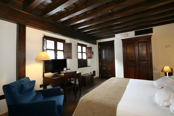 Imagen de la habitación del Hotel El Ladron De Agua Palacete. Foto 12