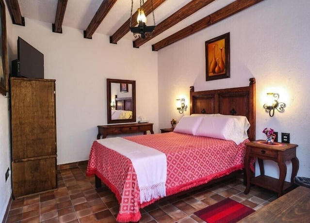 Imagen de la habitación del Hotel El Mes&oacute;n del Quijote. Foto 5