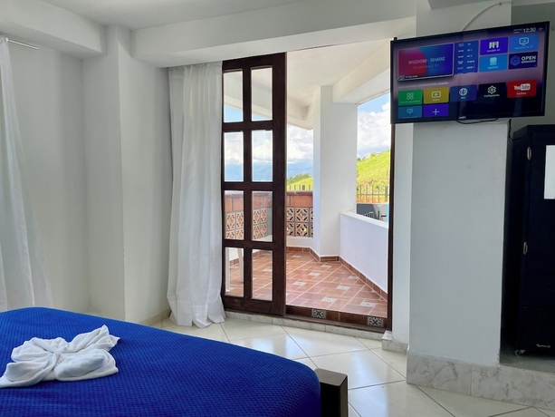 Imagen de la habitación del Hotel El Olimpo. Foto 8