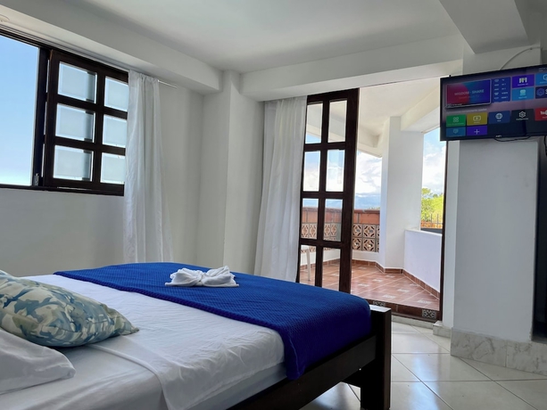 Imagen de la habitación del Hotel El Olimpo. Foto 9