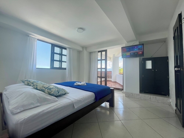 Imagen de la habitación del Hotel El Olimpo. Foto 10