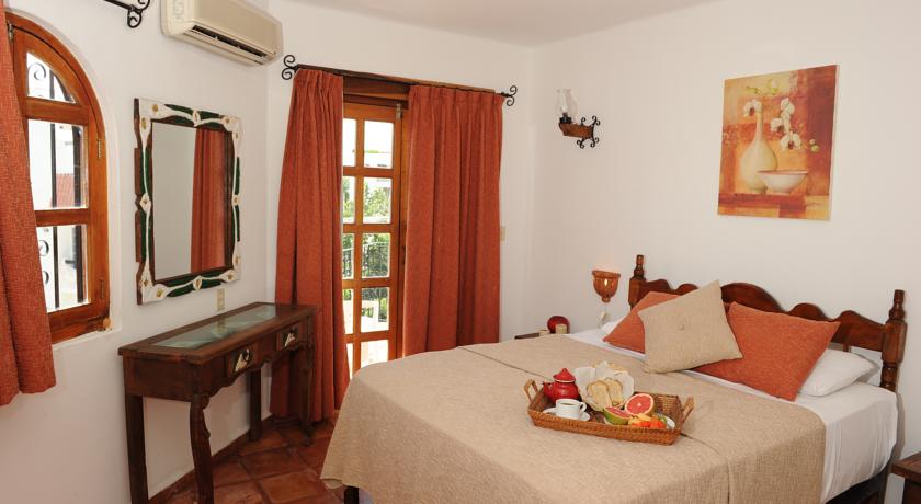 Imagen de la habitación del Hotel El Patio & Suites. Foto 10