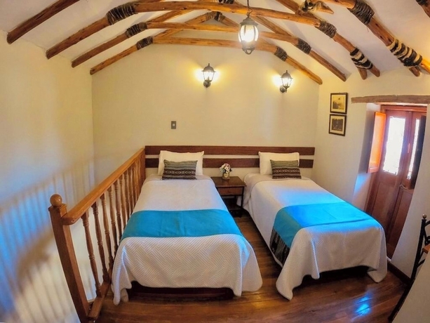Imagen de la habitación del Hotel El Portal de Qopuy Lodge. Foto 8