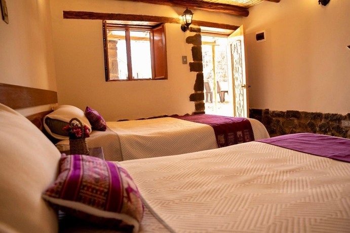 Imagen de la habitación del Hotel El Portal de Qopuy Lodge. Foto 9