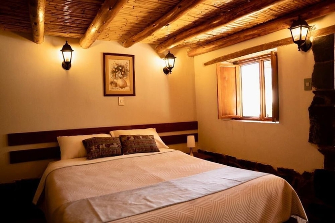 Imagen de la habitación del Hotel El Portal de Qopuy Lodge. Foto 11