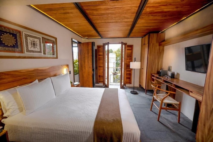 Imagen de la habitación del Hotel El Recinto Luxury. Foto 4