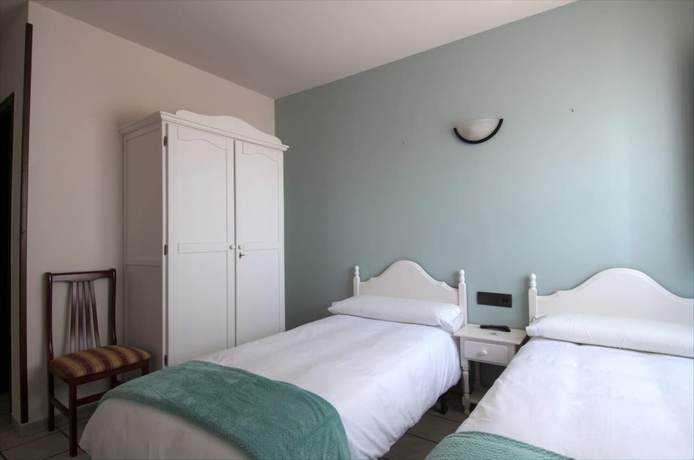 Imagen de la habitación del Hotel El Refugio Hosteria. Foto 11