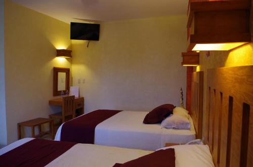 Imagen de la habitación del Hotel El Relicario. Foto 10