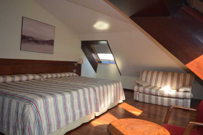 Imagen de la habitación del Hotel El Suizo. Foto 10