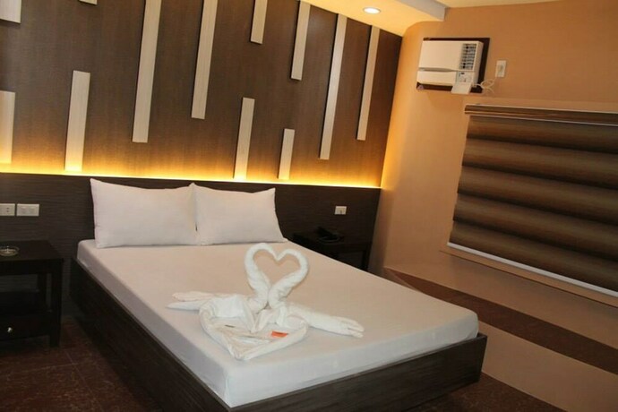 Imagen de la habitación del Hotel El Vistra Travellers Inn and Coffee Shop. Foto 31