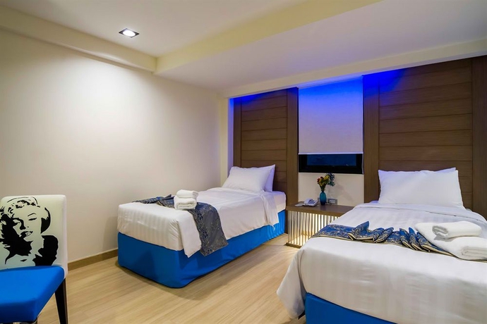 Imagen de la habitación del Hotel Eleven Avenue Suites. Foto 12