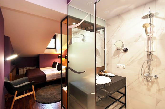 Imagen de la habitación del Hotel Elle Boutique. Foto 17