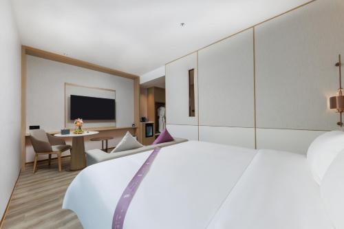 Imagen de la habitación del Hotel Elong Shenzhen South China City. Foto 16