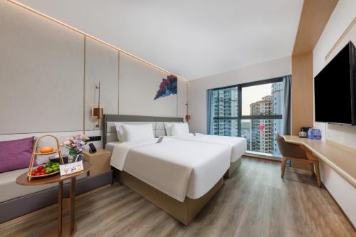 Imagen de la habitación del Hotel Elong Shenzhen South China City. Foto 18