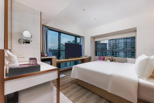 Imagen de la habitación del Hotel Elong Shenzhen South China City. Foto 19