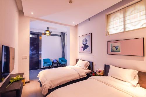 Imagen de la habitación del Hotel Elsewhere Boutique. Foto 8