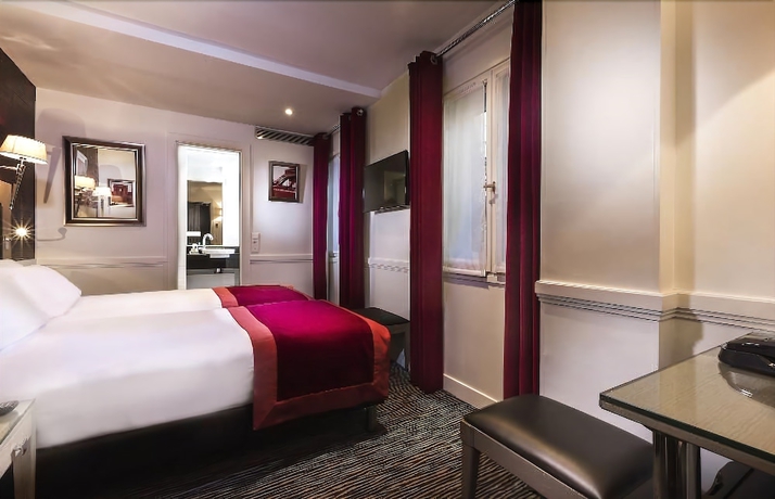 Imagen de la habitación del Hotel Elysées Flaubert. Foto 16