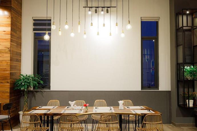 Imagen del bar/restaurante del Hotel Em Oi Boutique. Foto 5