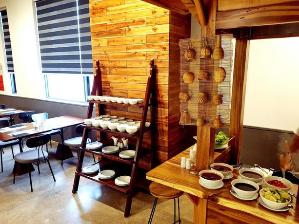 Imagen del bar/restaurante del Hotel Em Oi Boutique. Foto 10