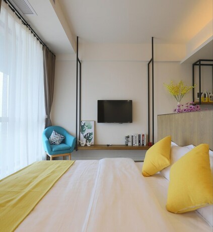Imagen de la habitación del Hotel Emei Volume Shutang Vacation Apartment. Foto 13
